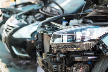 Cars waiting to be repair after accident on a repair shop. 