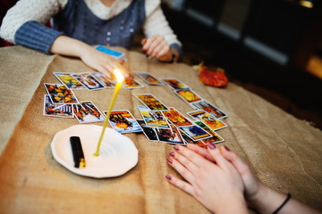 Divination by the Tarot cards. The fortune teller predicts the f