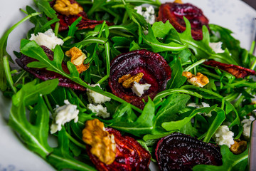 Raw green beet and arugula salad with blue cheese