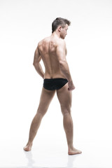 Fototapeta na wymiar Handsome muscular bodybuilder posing on white background. Isolated studio shot