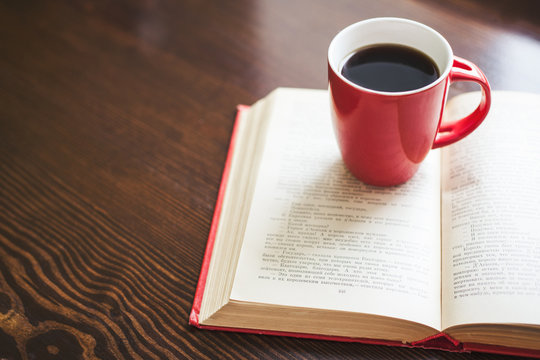 Cup of coffee and book