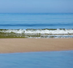 Fototapeta na wymiar sea calm, the sky and the strip of sand.