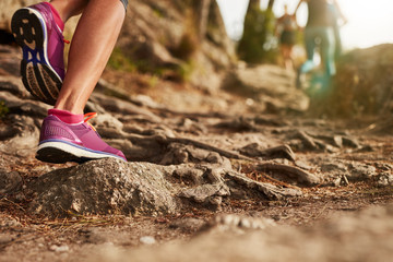 Athlete's sports shoes on a dirt track.