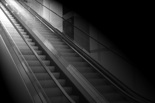 concept background of escalator with the light at the end