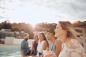 Group of friends enjoying poolside party