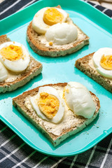 Sandwich with butter and egg.
