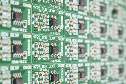 Computer chips on green circuit board