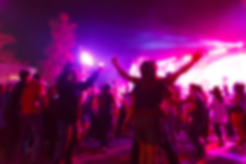 silhouette crowd in front of concert stage