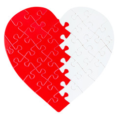 Red and white jigsaw puzzle in a shape of a heart