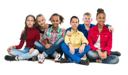 teenager friends sitting on the floor embracing