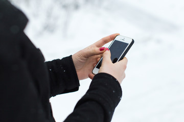 woman typing on the smartphone