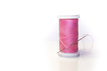 Needle in a spool of thread