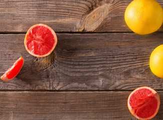 Ripe grapefruits on wooden background