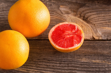 Ripe grapefruits on wooden background