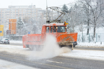 A tram snowplow clearing snow from tracks