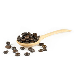 coffee beans in olive wood spoon, isolated on white
