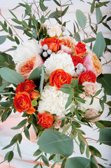 Beautiful bridal bouquet made of white and orange flowers