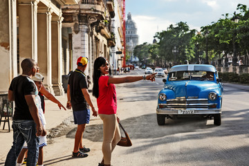 Cubans Stopping a Taxi in Havana; Cuba