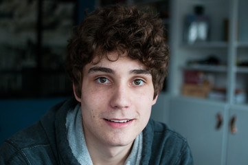teen boy looking at the camera