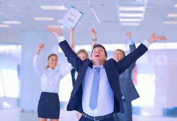 Business team celebrating a triumph with arms up 