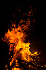Fototapeta na wymiar Fire flames on a black background.