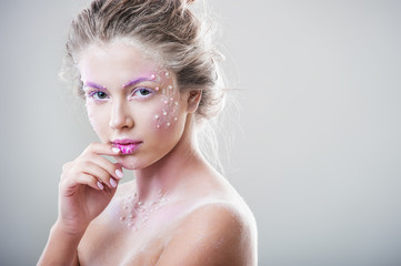 Portrait a beautiful woman with winter makeup 