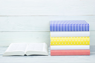 Stack of books on wooden table. Back to school. Copy space