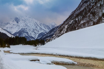 Fototapeta na wymiar Amazing river winter in the mountains, Julia alps