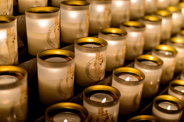PARIS, FRANCE - October 28, 2015: Candles in Notre-Dame de Paris. Notre-Dame de Paris - main...