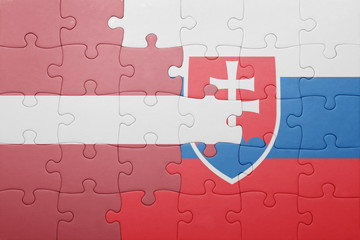 puzzle with the national flag of slovakia and latvia