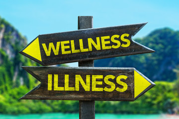 Wellness - Illness signpost in a beach background