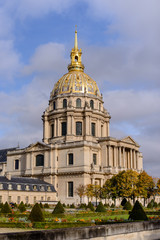 Fototapeta premium Golden dome of Les Invalides on background. Les Invalides - complex of museums and monuments, burial site for some of France's war heroes, notably Napoleon Bonaparte.