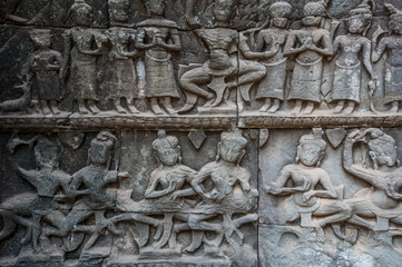 Relief carving on a stone wall at the ruined temple Ta Prohm at Angkor wat, Cambodia