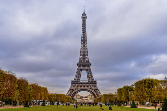 Eiffel tower in Paris with autumn colors and wide angle central perspective.