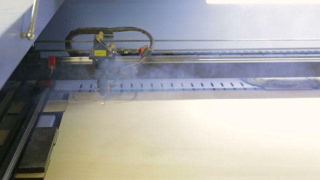 Laser cutting machine at work.  Cuting patterns for ship model