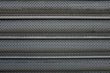 Metal shutters protecting shop frontage