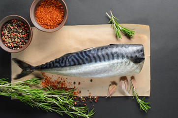 fresh raw mackerel on black background, top view