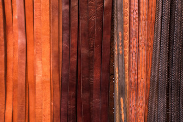 Hand crafted leather belts for sale in the souk in Marrakesh, Morocco.