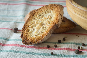 Slices of toasted bread on kitchen towel