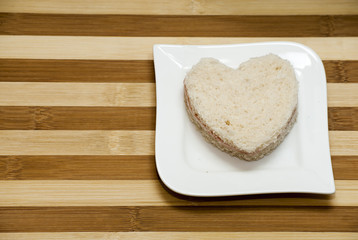 Love sandwich on a wooden background