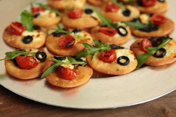 vegetable canapés on a silver tray
