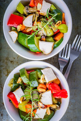 Tasty ratatouille made of zucchini, carrots, peppers and grilled chicken