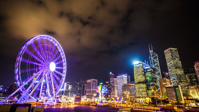 4k. Colorful Ferris wheel with a darkening sky. Hongkong. Timelapse
