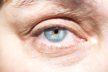 Beautiful mature woman blue eyes closeup