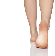 bare female feet on a white floor
