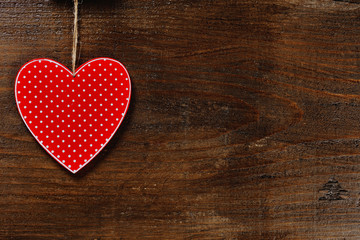 red heart on wooden background - love concept