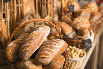 baskets of bread on a shelf, in a bakery store