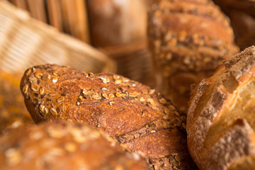 baskets of bread on a shelf, in a bakery store