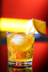 Glass of cocktail on bar background