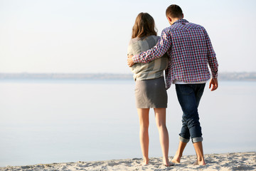 Young couple on the riverside